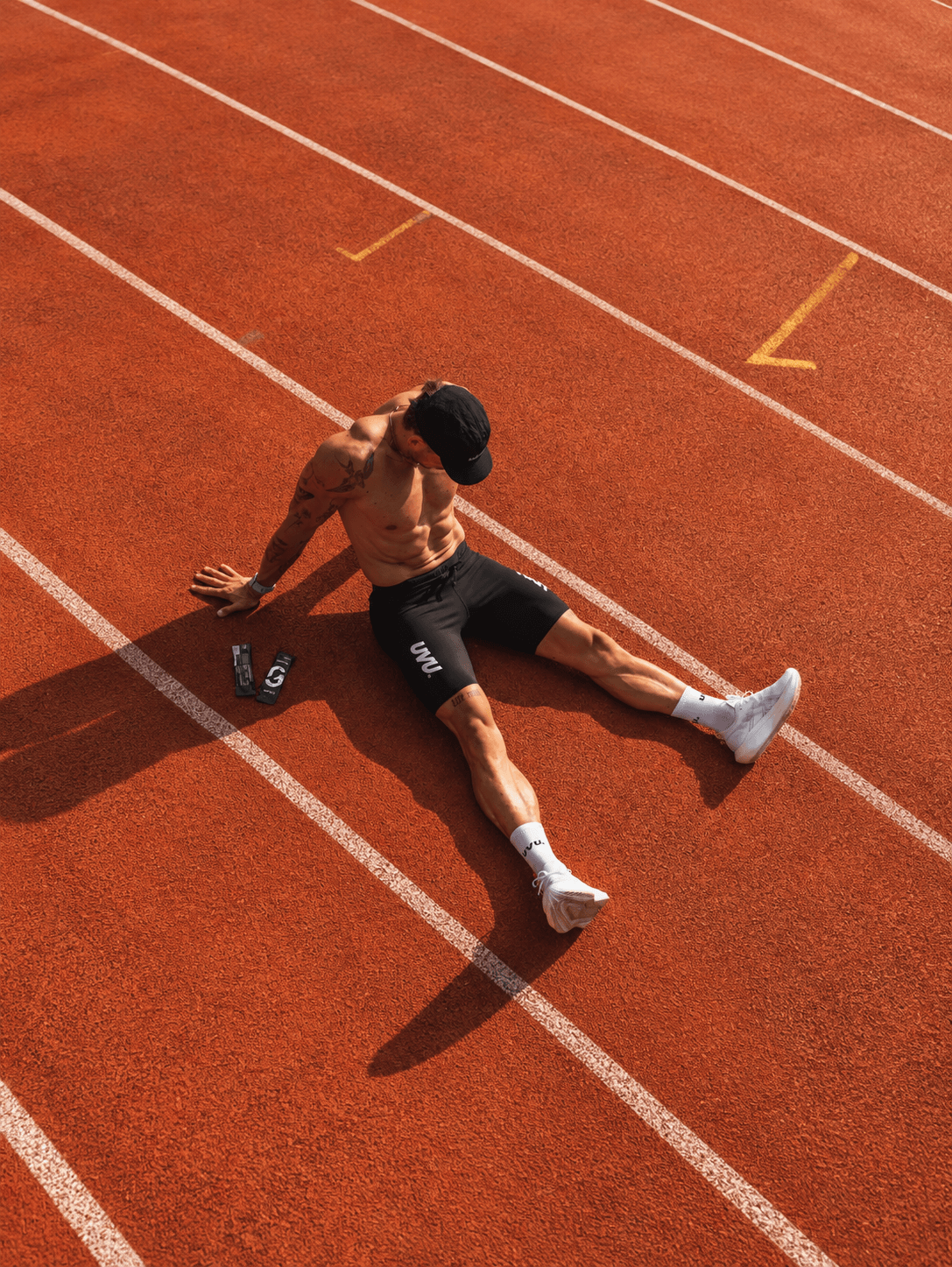 Athlete stretching on a running track